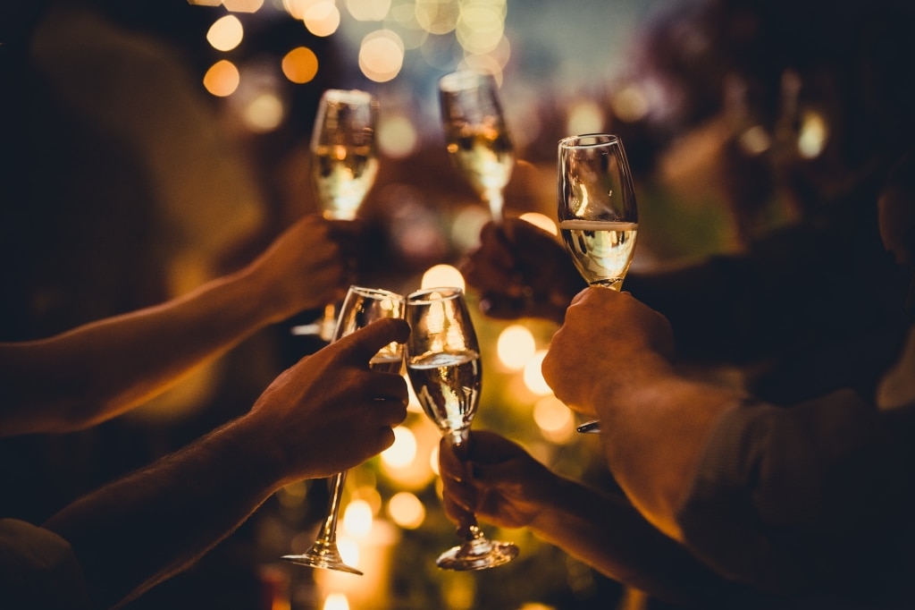 Groups of people enjoying glasses of champagne at Sandbourne Santa Monica