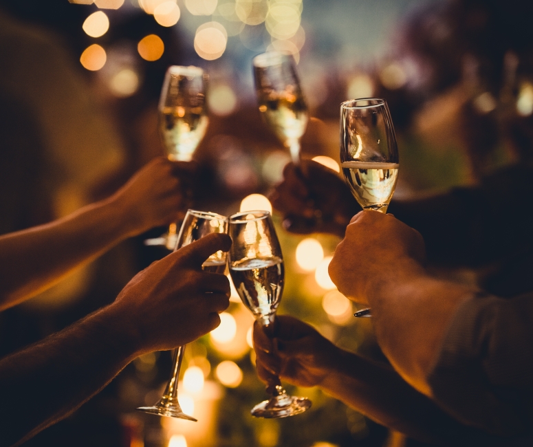Groups of people enjoying glasses of champagne at Sandbourne Santa Monica