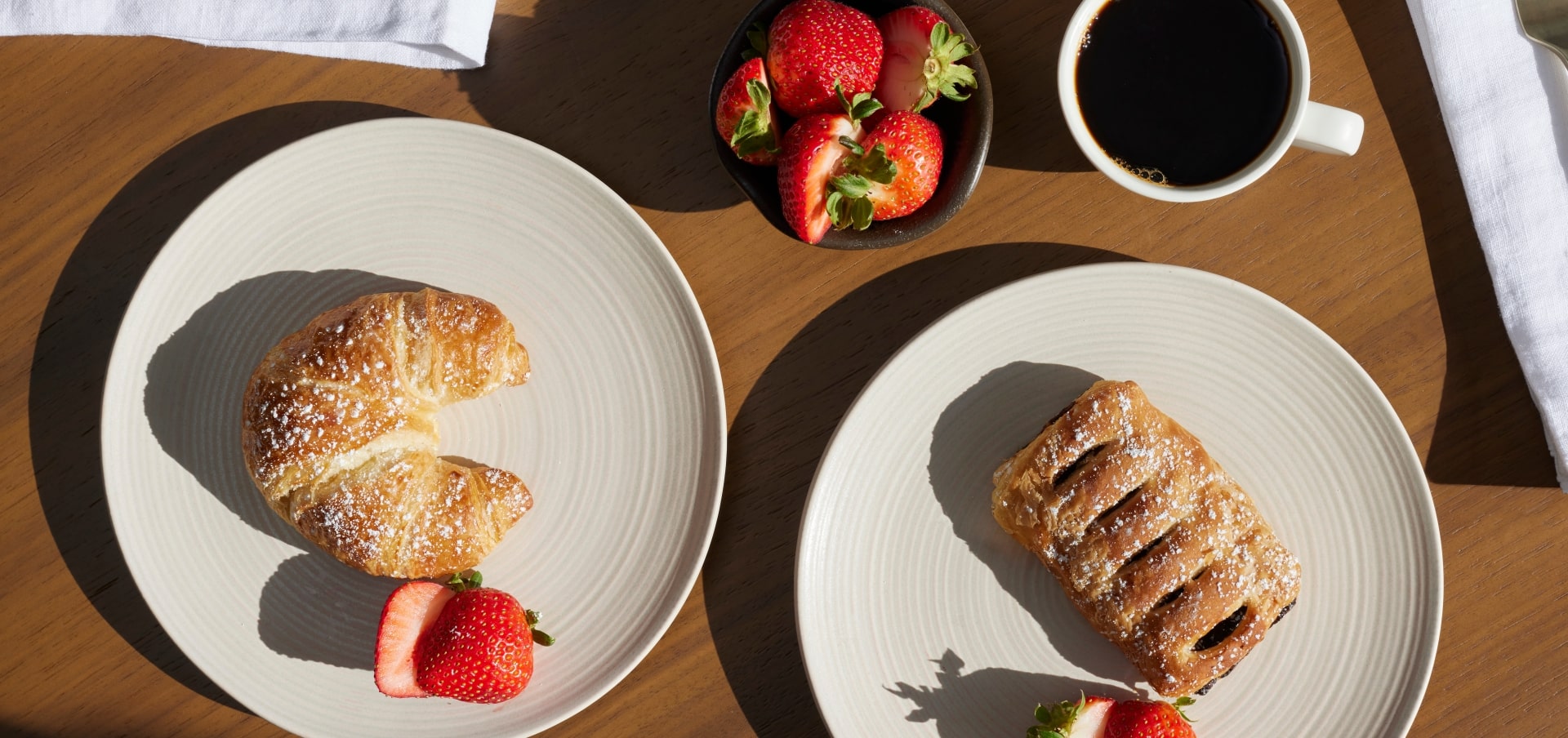 Baked goods with fruit and coffee