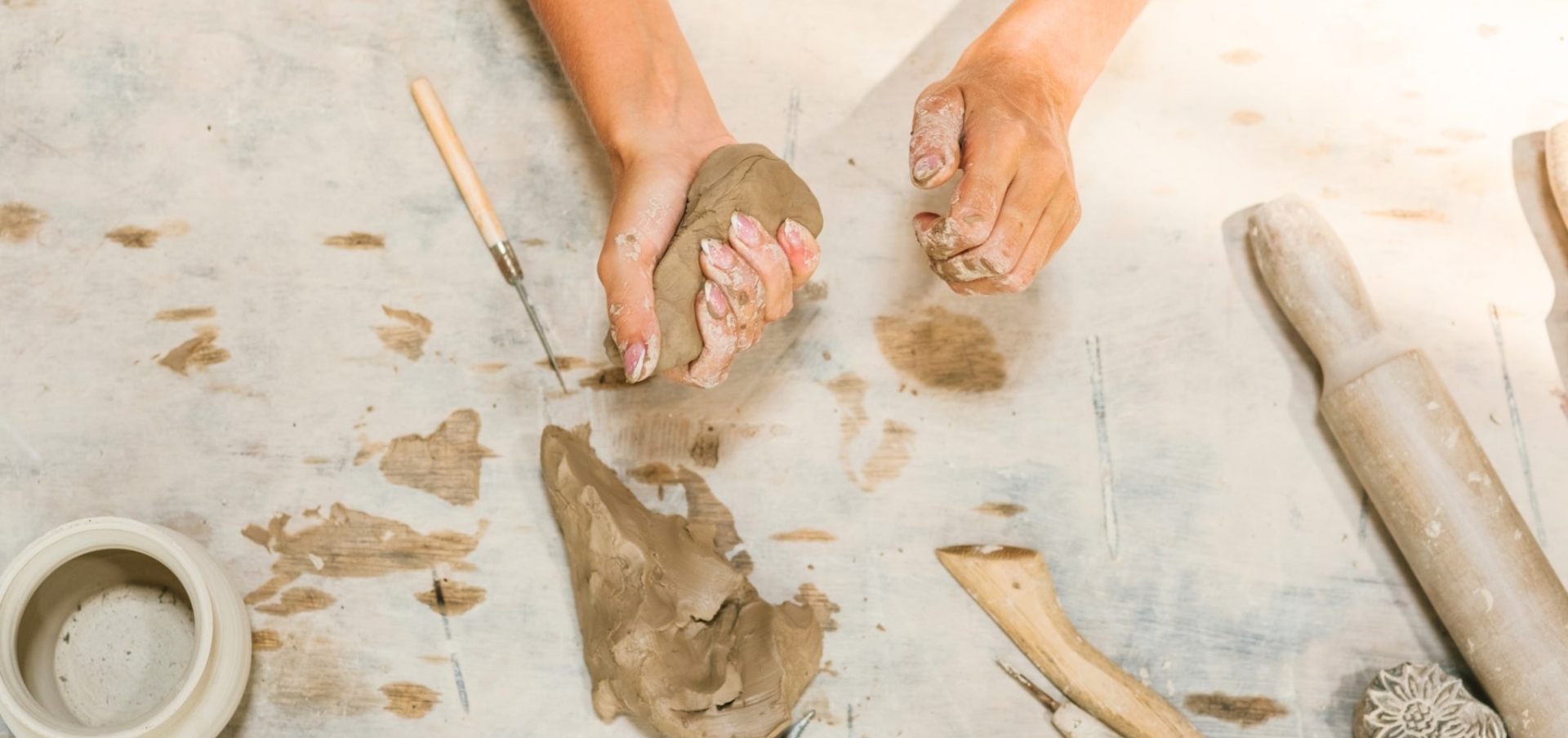 A woman making art with clay at Sandbourne Santa Monica