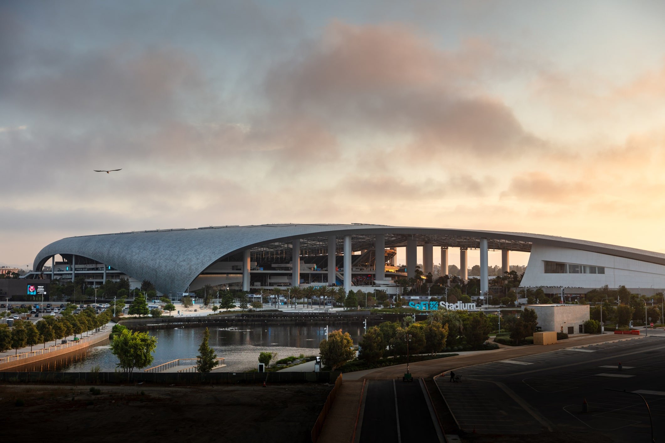 Exterior view of SoFi Stadium on a cloudy night